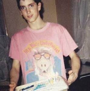 Young Marshall Mathers holding a cake