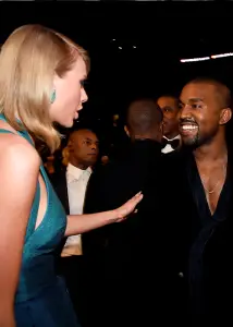 Taylor Swift and Kanye West talking to each other at the Grammy Awards 2015